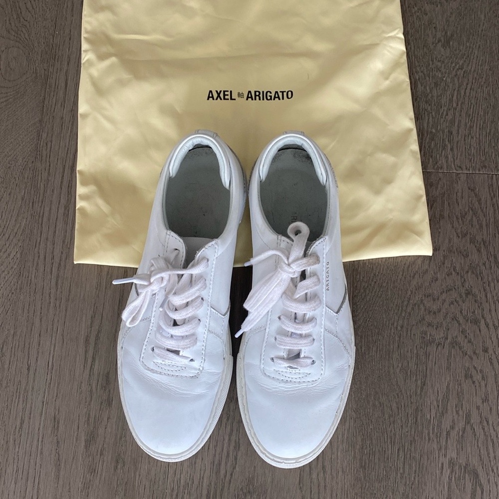 Pair of white leather trainers in good condition slightly worn.